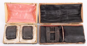 A pair of George III iron and leather shoe buckles studded with jet stones,