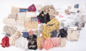 A box of trims including lengths of beads, sequins,