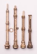 A group of four Victorian yellow or gilt metal seal top propelling pencils.