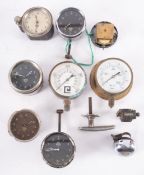 A group of five various Smiths dashboard clocks, together with a similar clock movement,