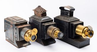 A group of three late 19th/early 20th century brass and tinplate Magic Lanterns (3)