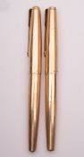 Two Parker 61 gold plated fountain pens.