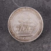 A Victorian Royal Naval LSGC Medal converted to a brooch, name to edge for 'J J Wilkie ,