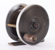 A brass and alloy trout reel with composite handle,