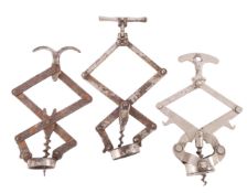 Three steel French lazy tongs, including a marked Debouchtout corkscrew by Bte S.G.D.G.