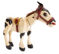A carved wooden articulated 'Muffin the Mule' figure 19cm high.
