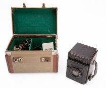 A Thompson Pickard 'Junior Special' camera, with glass slides, in its original case, circa 1926.