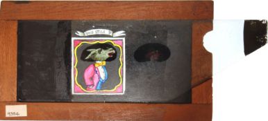 A mahogany framed single slip hand painted magic Lantern slide 'Man's head changes to donkey in