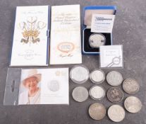 A collection of coins comprising a 1999 silver £5 coin, Bank of England 2oz fine silver £5 coins,