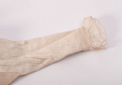 A child's cotton night dress with pin tuck pleats to the sleeves;