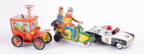 Tinplate Technoifix friction driven Scooter with rider and Lady passenger, circa 1960,