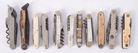 Eleven assorted folding knives with corkscrews, including a Laguiole type leg-shaped, a C.