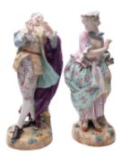 A pair of large late 19th century Continental porcelain figures of a gallant and companion wearing