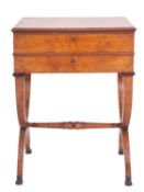 A Regency or George IV burr walnut work table, circa 1820; the hinged top with moulded edges,