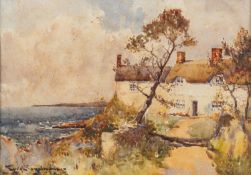 Charles Eyres Simmons (British,1902-1914) A Continental town centre with a view of the church,