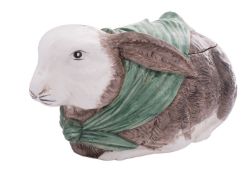A large pottery 'rabbit' tureen and cover in the form of a rabbit wearing a green scarf,