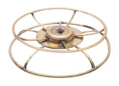 A George III brass platter warmer or kettle stand, early 19th century; of circular openwork form,