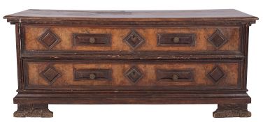 An Italian walnut coffer, Tuscan or the Veneto, basically 16th century; of 'mule' form,