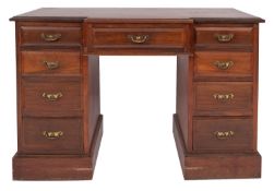 An Edwardian mahogany breakfront pedestal desk,