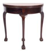A George III mahogany demi-lune tea table, late 18th century; the hinged top with reeded edges,