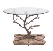 A wrought iron and glass topped conservatory table,