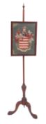 A George III mahogany and Berlin woolwork polescreen,