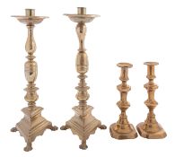 A pair of brass candlesticks in Spanish 17th century style,