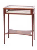 A late Victorian or Edwardian mahogany and glazed bijouterie table,