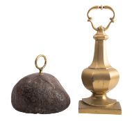 A brass door porter in the form of a faceted urn,