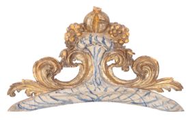 A Continental carved, painted and parcel gilt and silvered wood overdoor,