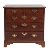 A George III stained mahogany chest of drawers, late 18th century; the top with moulded edges,