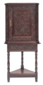 An oak corner cupboard on stand,