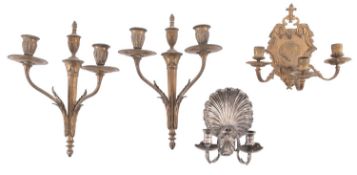 A pair of gilt metal twin light wall appliques in Empire style,