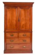 A Victorian mahogany linen press, late 19th century; with moulded cornice above twin panel doors,