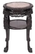 A Chinese carved and stained hardwood and marble topped stand,