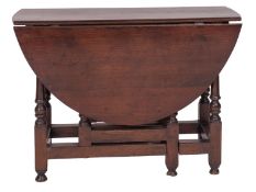 An oak gateleg dining table,