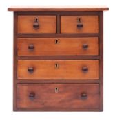 A miniature walnut chest of drawers,