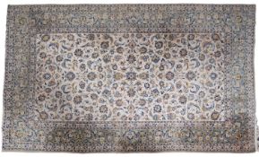 A Kashan carpet, the ivory field with an all over Shah Abbas design,