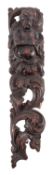 A carved and stained walnut herm, early 17th century; relief carved with a torso length male figure,