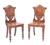 A pair Victorian mahogany hall chairs,