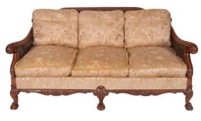 A carved mahogany and Damask silk upholstered bergère suite,