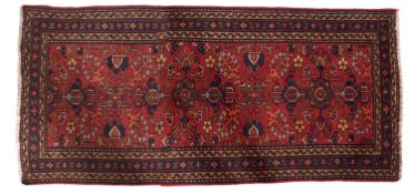 A Malayer runner, the madder field with an all over geometric design of palmettes,
