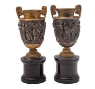A matched pair of patinated and gilt metal models of the Townley Vase,