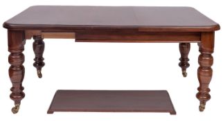 A Victorian walnut extending dining tabl