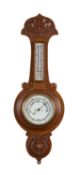 An oak cased wall barometer early 20th c