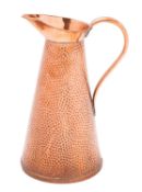 A repousse worked brass circular warming
