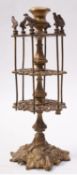 A Victorian gilt cast brass two-tier cot
