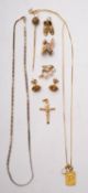 A pair of gold earrings in the form of r