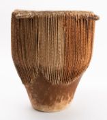 An African hide drum. 44cm high.