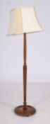 A stained hardwood standard lamp, 20th c
